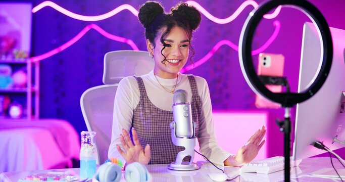 Influencer, girl and live streaming with phone, mic or technology in neon light for social media followers. Bedroom content creator, broadcast or woman talking for recording review and advice at home