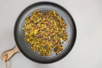Methi chi Vadi or Methi Thalipeeth. It is a healthy snack made with fresh fenugreek leaves, onion, green chili and homemade spices. Thalipeeth is a savoury multigrain flatbread popular in Maharashtra.