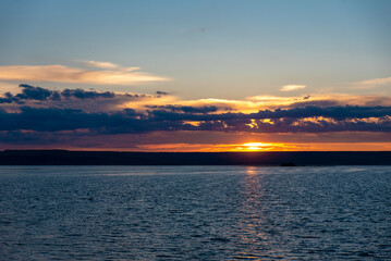 beautiful sunset on the sea view from afar