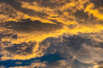 Enjoy a panoramic view of the skyline. The sun rises in the morning sky with colorful clouds. and beautiful cloud patterns In the soft light of the morning	