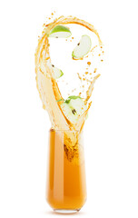 Apple juice in glass with flow of juice, bright gold splashes, flying drops, levitated green apples, leaves, isolated, white background. Refreshing drink for advertising, design, flyer, card, poster.