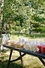 Fresh cut fruit and berries, various types of watermelon, melon which are being packed in transparent plastic cup. Snack ready to go in the park market.