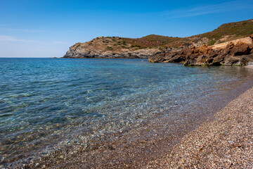 View of the stone beach of the village of Argentiera (Sassari province, Sardinia Island, Italy)....