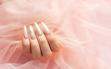 Female Hands with beautiful pearl manicure