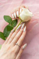 Female Hands with beautiful pearl manicure