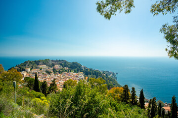 Taormina, Sicily. View of town, theater and Etna	