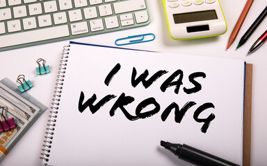 I WAS WRONG .  Notepad and computer keyboard on white office table