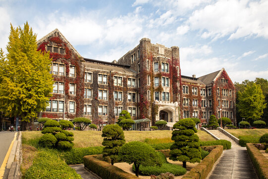 Seodaemun-gu, Seoul, South Korea - October 21, 2022: Autumnal view of yard and maple ivy on the wall of Yeonhui Hall at Yonsei University
