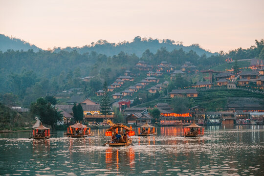 Chinese boats and a cloudy sunset at Ban Rak Thai village Thailand