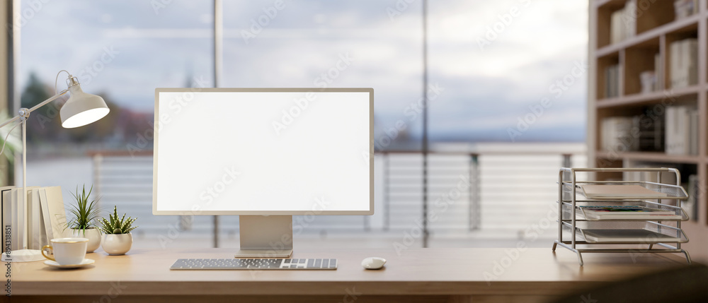 Aufkleber a computer with a white-screen mockup on a wooden table in a modern office with an ocean view.