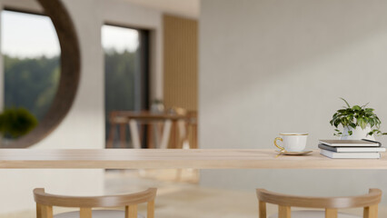 A wooden table in a cozy contemporary room with decor and a copy space for display products.