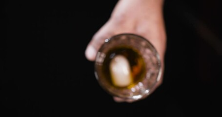 Falling Ice into a Glass of Whiskey.