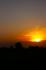 Sunset Sky Clouds in the evening with Red, Orange, Yellow and purple sunlight on Golden hour after sundown, Romantic sky in summer on Dusk Twilight. heart sky.