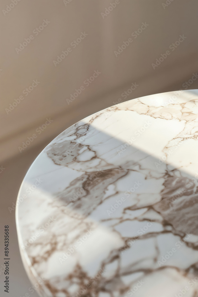 Poster Sunlight falling on an empty round marble table top, creating a bright and airy atmosphere