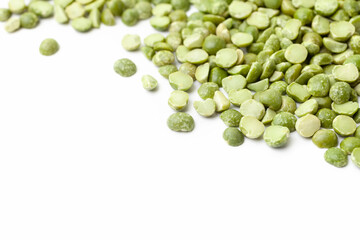 Split green peas pile on white background. Dry peas grains