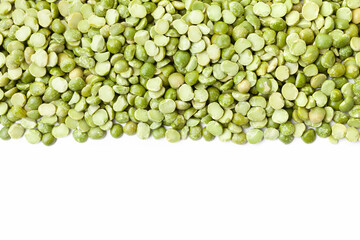 Uncooked, green peas border on white background. Copy space for text. Top view