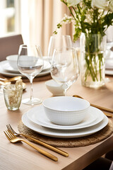 Luxurious Dining Table Set-up featuring White Ceramic Plates, Silverware, Crystal Glassware, and Floral Centrepiece