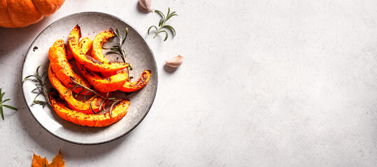 Roasted pumpkin slices with garlic and herbs