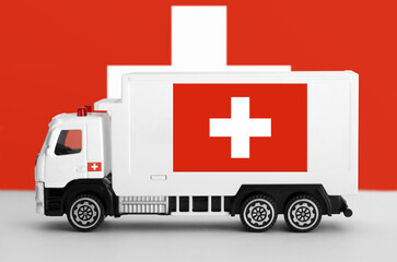 Switzerland flag depicted on side wall of white delivery van close up. Shipping and local delivery concept