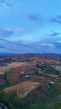 Breathtaking sunset views of Sicily's rugged mountains and serene coastal waters from above. Heraclea Minoa. Sunset drone view, Sicily, Italy. 
