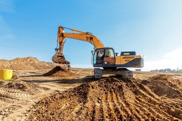 Obraz premium Yellow Excavator at Construction Site.