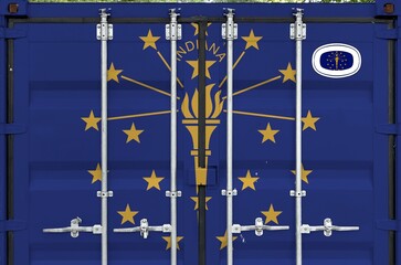 Indiana US state flag depicted on metal doors of shipping cargo container outdoors in docks area close up