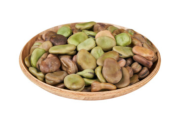 closeup pile of dry broad bean isolated on white background in wood bowl