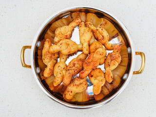 Dough knots with garlic butter in a bowl top view