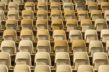 Naklejka premium Empty stands and seats for fans and fans in the open-air stadium. Lack of fans during the pandemic.. Beautiful simple AI generated image in 4K, unique.