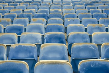 Naklejka premium Empty snow-covered stands of the stadium. Beautiful simple AI generated image in 4K, unique.