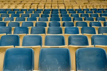 Naklejka premium Empty stands and seats for fans and fans in the open-air stadium. Lack of fans during the pandemic.. Beautiful simple AI generated image in 4K, unique.