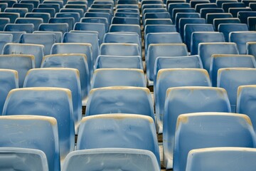 Empty stands and seats for fans and fans in the open-air stadium. Lack of fans during the pandemic.. Beautiful simple AI generated image in 4K, unique.