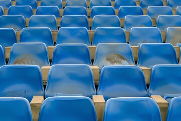 Obraz premium Close-up taken of empty blue stadium seats with no people around. Beautiful simple AI generated image in 4K, unique.