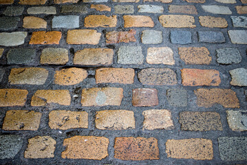 closeup of wet cobblestone in a medieval village