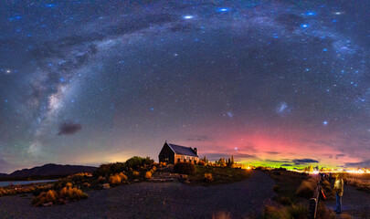 Milky Way, Nebula, Aurora Australis glowing over Church of the Good Shepherd at Lake Tekapo, New...