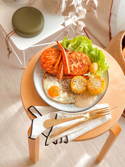 Breakfast dish with sunny side up egg, tomato, corn, and carrot. Delicious food. Cooking recipes. Healthy recipe. Healthy meal. Bruch menu. Diet food. Easy home cooking. Happy holidays. American. 