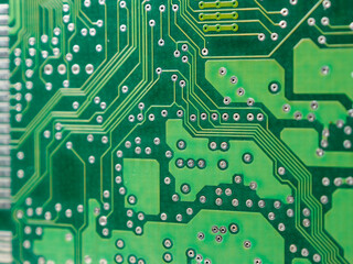 Close-up of a printed circuit board with chips, showing the complex connections and electronics parts