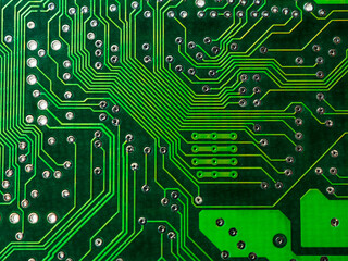 Close-up of a printed circuit board with chips, showing the complex connections and electronics parts