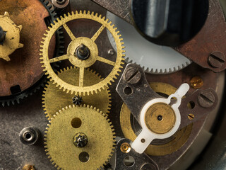 Close-up of a mechanical device with gears and teeth, demonstrating the complexity of repairing and...