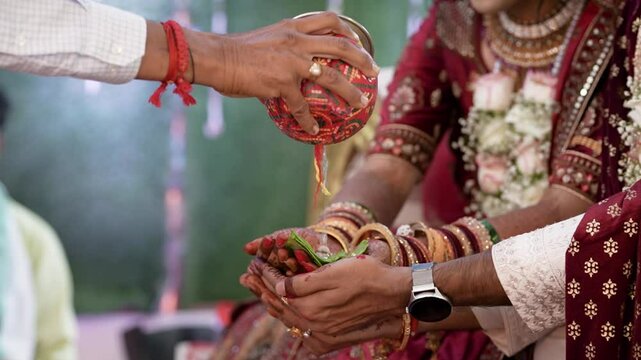 A shot of an Indian Wedding where rituals are being performed