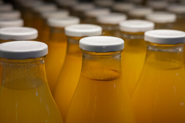 Detail of refrigerated bottles containing traditional homemade poultry broth