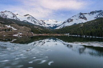 Trout Lake and snowy mountains at sunset, near Lizard Head Pass, Colorado, United States of America.