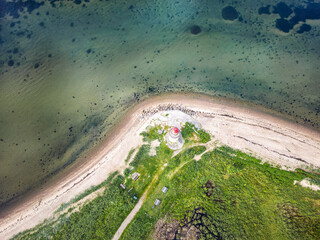 Small lighthouse in Traeskohage at the fjord in Vejle, Denmark