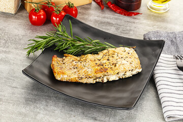 Baked salmon fish served rosemary