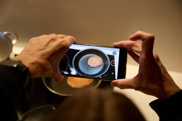 Recording on video how a pancake is cooked