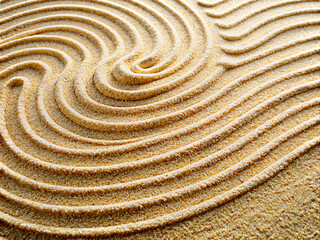Fototapeta premium close up of a spiral, Sand pattern as background. Zen pattern in white sand. Beach sand texture in summer sun.