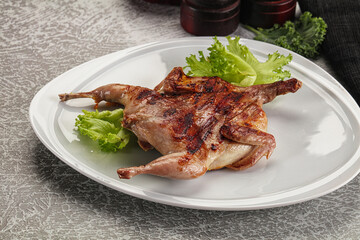 Grilled quail in the plate