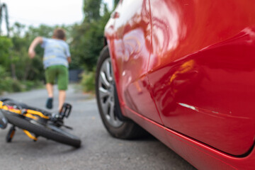 Unlucky little boy crashes his bike into a car and runs away