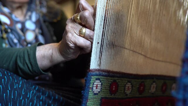 aunt knitting old carpets, woman making carpet