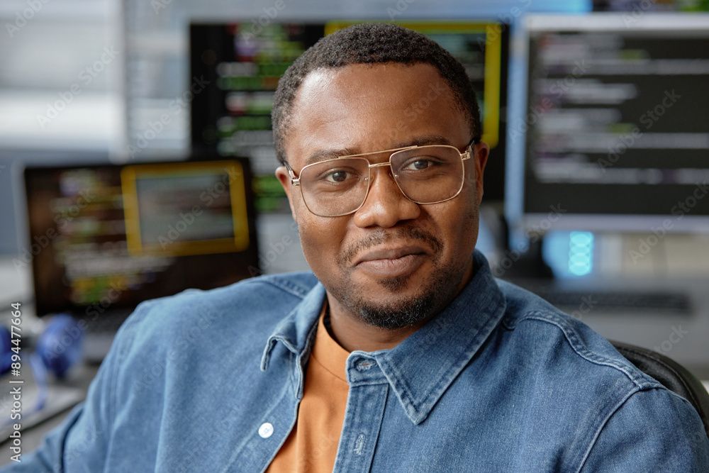 Poster close up portrait of young male african american vr software engineer in glasses happily smiling loo